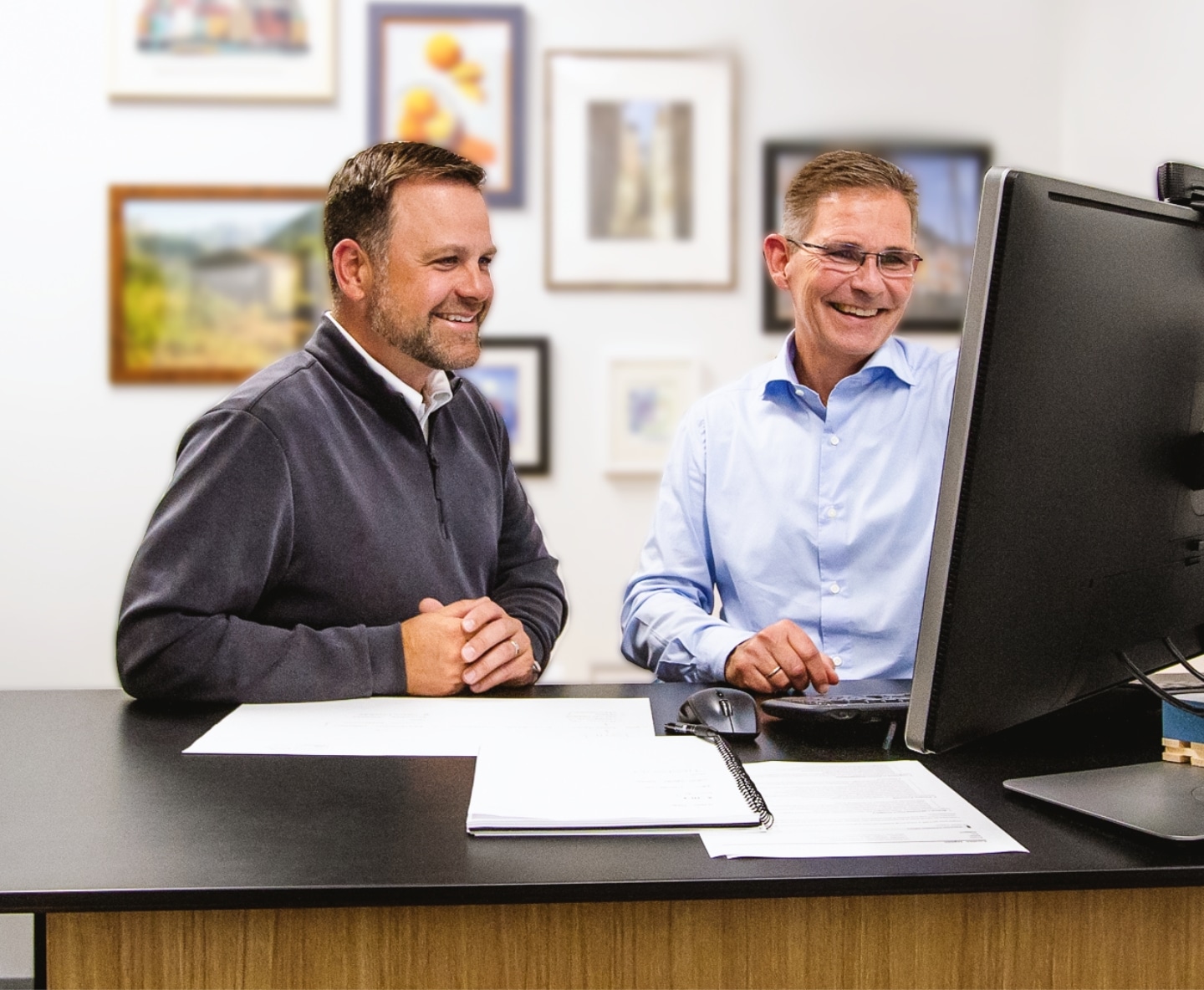 Two men at a computer